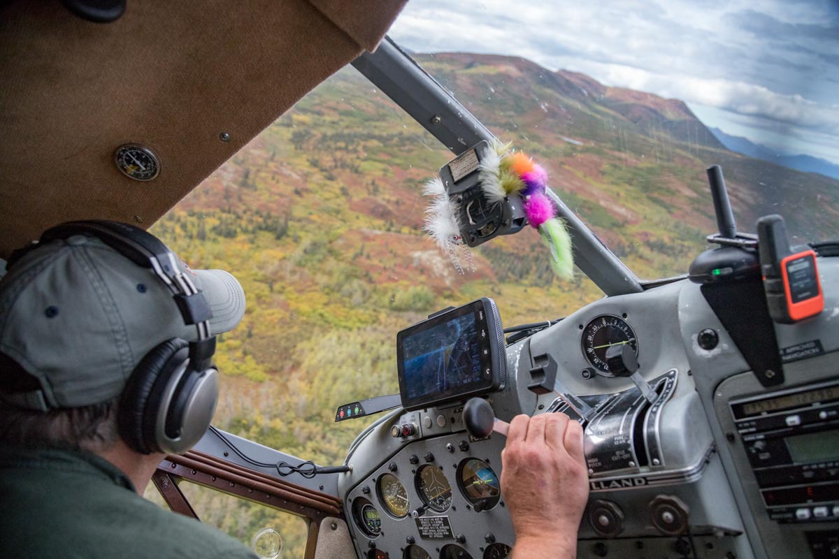 Alaskan bush pilot flying a DeHavilland Beaver on floats