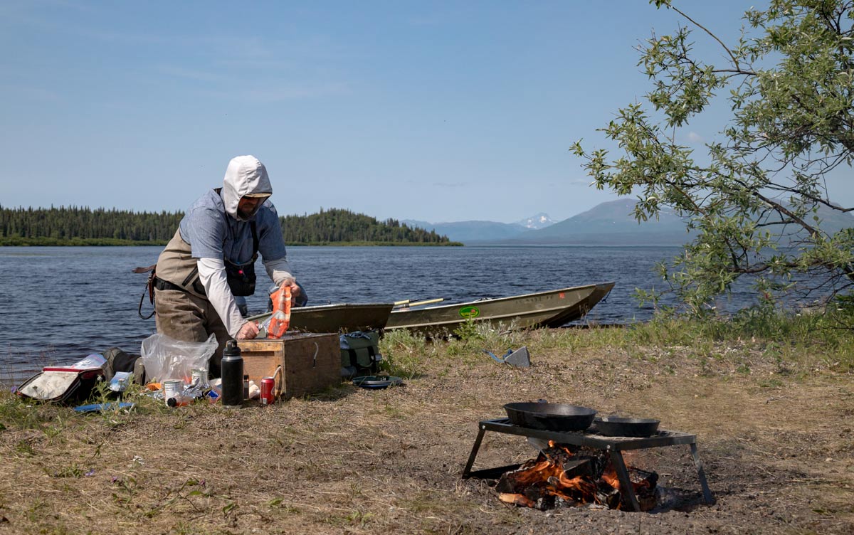 Making a salmon shore lunch while fishing in Bristol Bay
