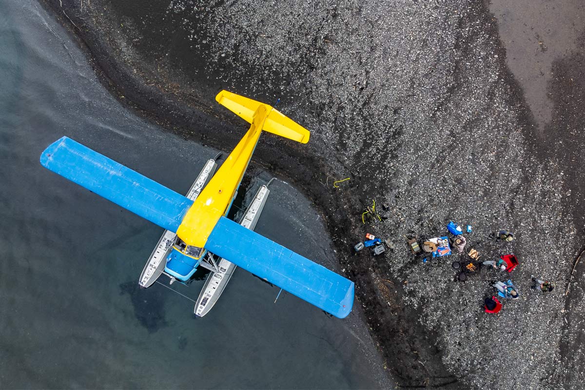 Overhead shot of float plane parked on beach