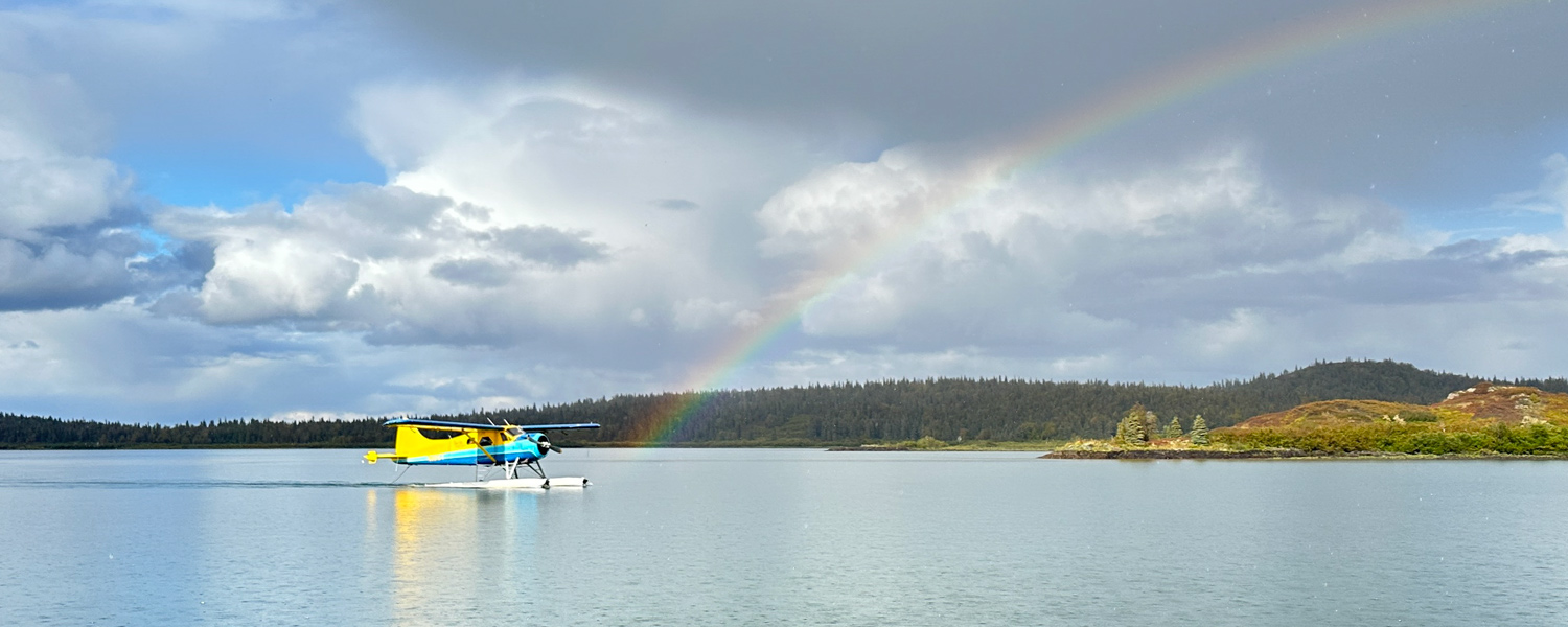 Tikchik float plane with rainbow