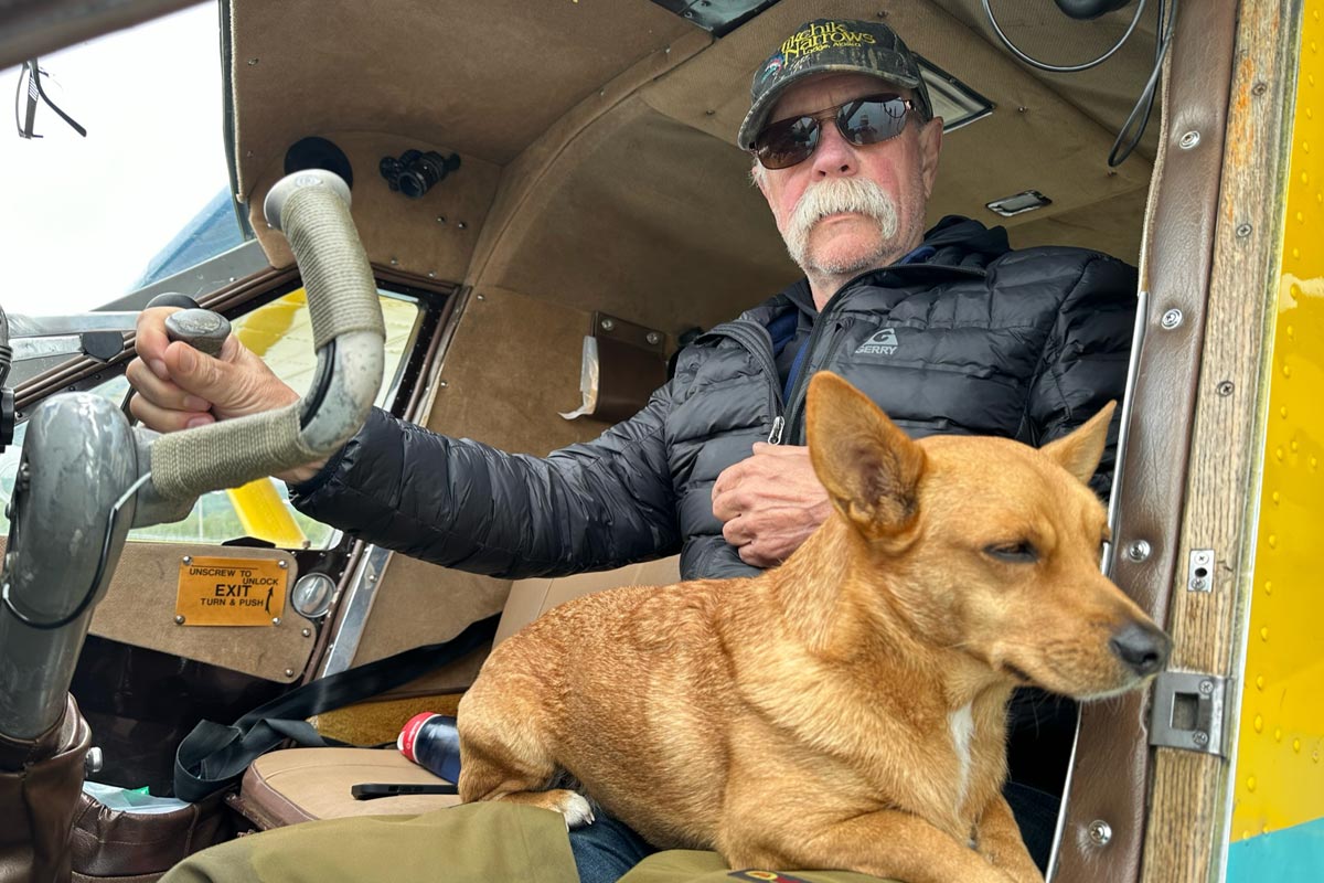 Tikchik Narrows Lodge pilot with his dog